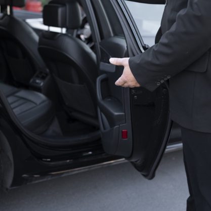 driver-with-opened-car-door